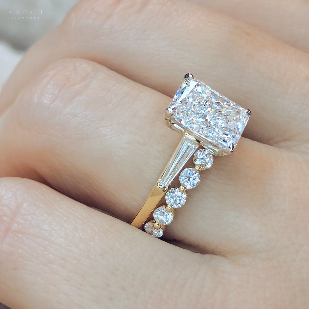 radiant-cut-diamond-engagement-ring-with-thin-tapered-baguette-diamonds-and-custom-wedding-ring-by-Ascot-Diamonds