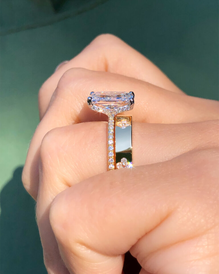 yellow gold ascot hidden halo diamond engagement ring paired with a custom gold clover diamond wedding band by Ascot Diamonds Atlanta